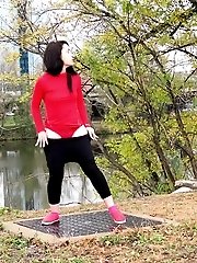 15 pictures - Dark haired European pisses outside by river