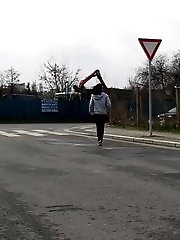 15 pictures - Dark haired girl pisses by a public car park
