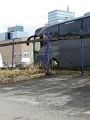 15 pictures - Dark haired girl pisses by a public car park