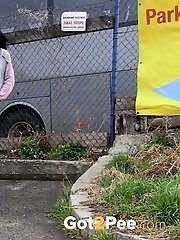 15 pictures - Dark haired girl pisses by a public car park