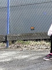 15 pictures - Dark haired girl pisses by a public car park