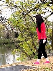 15 pictures - Dark haired European pisses outside by river
