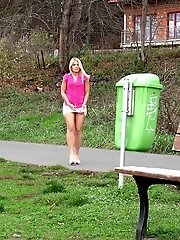 15 pictures - Stunning blonde pisses outside on a bench