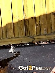 15 pictures - Raven haired babe leaves a piss puddle outside