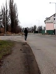 15 pictures - Sexy brunette babe pisses behind a bus stop