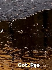 15 pictures - Raven haired babe leaves a piss puddle outside