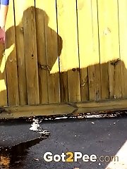 15 pictures - Raven haired babe leaves a piss puddle outside