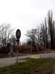 15 pictures - Sexy brunette babe pisses behind a bus stop