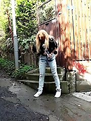 15 pictures - Stunning blonde pisses her denims outside