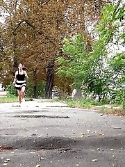 15 pictures - Pretty brunette leaves a wet patch after peeing