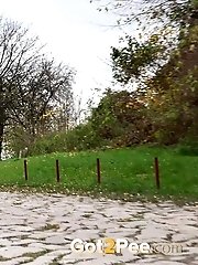 15 pictures - Gorgeous blonde in knee boots pisses outside