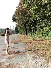 15 pictures - Raven haired babe leans on concrete to piss