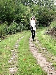 15 pictures - Nervous European girl pisses on grass outside