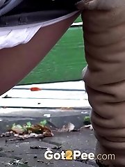 15 pictures - Sexy girl squats on a path and pisses outside