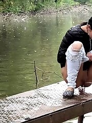 15 pictures - Exotic babe pisses twice in this outdoor scene