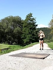 15 pictures - Sexy blonde pisses on a path in a golf course