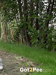 15 pictures - Dark haired exotic babe squatting to pee outside