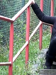 15 pictures - Pretty brunette girl pisses on the steps