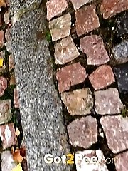 15 pictures - Closeup pissing action for puffy pussy lipped babe