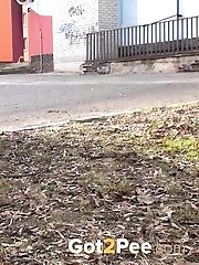 15 pictures - Brunette really needs to piss while outside