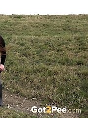 15 pictures - Dark haired babe pisses in the countryside