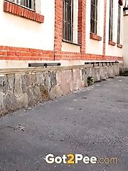 15 pictures - Brunette babe in her own public pissing video