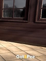 15 pictures - Dark haired babe squats to piss outside