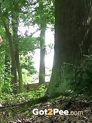 15 pictures - Sexy blonde pees in the forest