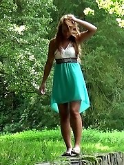 15 pictures - Girl lifts her dress and pees into a river