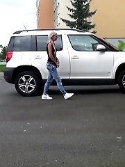 15 pictures - Blonde pisses next to a parked car