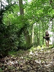 15 pictures - Sexy blonde pees in the forest