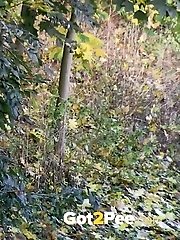 15 pictures - Sexy raven haired girl pisses in the leaves