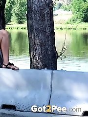 15 pictures - Public pissing for gorgeous dark haired babe