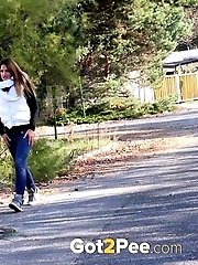 15 pictures - Brunette is all wrapped up while peeing