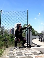 15 pictures - Outdoor pissing for pretty dark haired babe