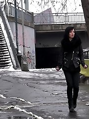 15 pictures - Pretty dark haired girl melts snow as she pees