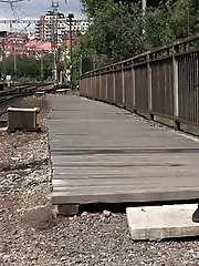 15 pictures - Dark haired European pissing outside in public