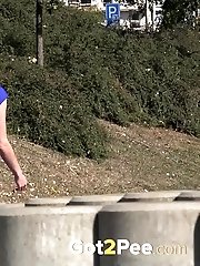 15 pictures - A babe wearing no panties pisses in public