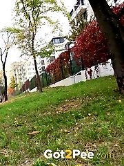 15 pictures - Hot blonde in pink pisses outside on grass