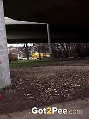 15 pictures - Pretty girl in red dress pisses on the ground