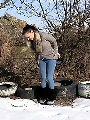 15 pictures - Dark haired babe squats to piss in the snow
