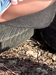 15 pictures - Dark haired babe squats to piss in the snow