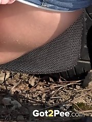 15 pictures - Dark haired babe squats to piss in the snow