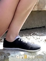 15 pictures - Raven haired babe squatting to pee outside