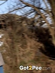 15 pictures - Dark haired babe squats to piss in the snow