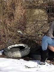15 pictures - Dark haired babe squats to piss in the snow