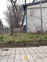 15 pictures - Redhead babe pisses in the middle of the city
