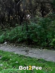 15 pictures - Hot babe pees on a public path while outside