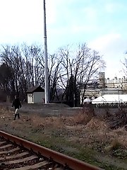 15 pictures - Brunette girl pulls down her trousers to pee outside