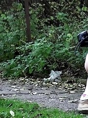 15 pictures - Hot babe pees on a public path while outside